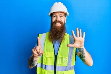 Poster - Redhead man with long beard wearing safety helmet and reflective jacket showing and pointing up with fingers number six while smiling confident and happy.