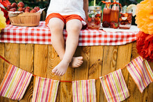 Lemonade Stand. Adorable Little Girl Trying To Sell Lemonade. Strawberry Lemonade With Ice And Mint As Summer Refreshing Drink In Jars. Cold Soft Drinks With Fruit. Child Drinking Lemonade In Jar