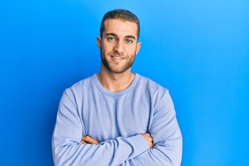 Sticker - Young caucasian man wearing casual clothes happy face smiling with crossed arms looking at the camera. positive person.