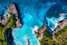 Waves And Rocks As A Background From Top View. Blue Water Background From Top View. Summer Seascape From Air. Bali Island, Indonesia.