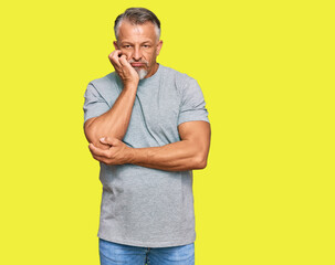 Poster - Middle age grey-haired man wearing casual clothes thinking looking tired and bored with depression problems with crossed arms.