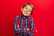 © Krakenimages.com - Adorable latin kid wearing casual clothes happy face smiling with crossed arms looking at the camera. positive person.