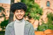 © Krakenimages.com - Young african american businessman smiling happy standing at the park.