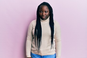 Sticker - Young black woman with braids wearing casual winter sweater depressed and worry for distress, crying angry and afraid. sad expression.