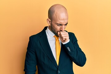 Sticker - Young hispanic man wearing business suit and tie feeling unwell and coughing as symptom for cold or bronchitis. health care concept.