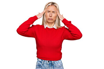 Canvas Print - Young blonde woman wearing casual clothes suffering from headache desperate and stressed because pain and migraine. hands on head.