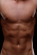 © Giulio_Fornasar - Close up on the naked flat toned torso of a young man