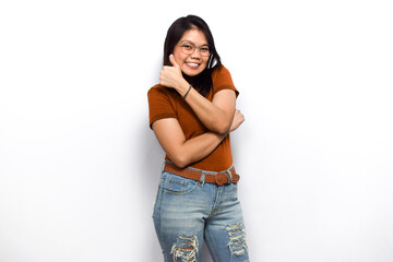 Smile and thumb up sign of Young beautiful asian women dress orange shirt isolated on white background