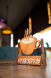 © abramov_jora - Reserved sign on a table in a modern restaurant. Reserve sign design