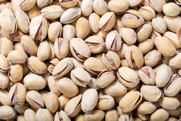 Poster - pistachios as background, top view