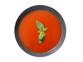 Wall Mural - plate of tomato soup with basil isolated on a white background