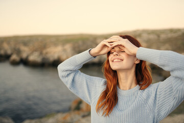 pretty woman in blue sweater enjoy nature fresh air freedom