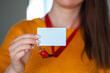 © perfectlab - Woman holding badge name tag, with blank space mock up