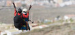 © pavel1964 - Flying tandem paragliders over the city on a sunny day