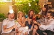 © Impact Photography - Friends drinking cocktails while celebrating birthday