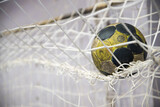 Handball ball in the net, on goal, futsal