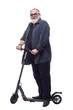 © ASDF - bearded man with an electric scooter looking at you.