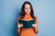 Photo of dreamy peaceful woman read book focused face posing on blue background