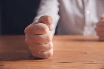 Wall Mural - male fists on the table