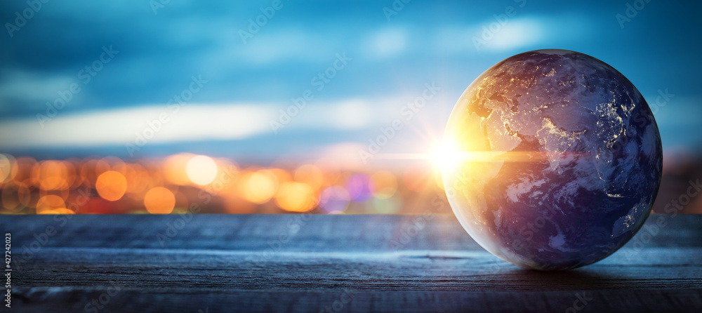 Planet earth on the background of blurred lights of the city. Concept on business, politics, ecology and media.  Elements of this image furnished by NASA - obrazy, fototapety, plakaty 