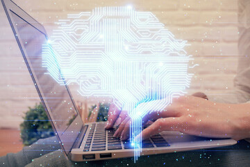 Multi exposure of woman hands working on computer and brain hologram drawing. Ai concept.