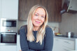 © shapovalphoto - Beautiful woman blonde sit at table kitchen, look at camera