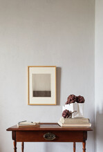 Wooden Frames Mockup. Dry Decorative Artichokes In A Vase On An Old Wooden Desk. Composition On A White Wall Background