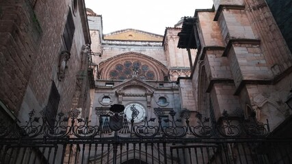 Wall Mural - Toledo Cathedral exterior. Portal of the Clock entrance behind fence. The Primate Cathedral of Saint Mary of Toledo or Catedral Primada Santa Maria de Toledo, Spain. Famous place landmarks concept