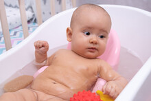 Funny Kid Bathes In The Bathroom. Baby Bathing