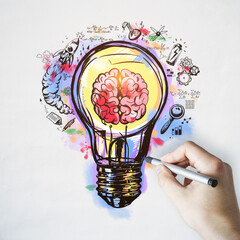Idea and startup cocnept with hand writing sketch with human brain, rocket, battery and mathematical formulas inside light bulb