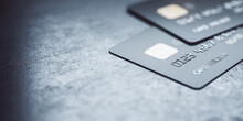 Online Payments Concept With Black Credit Cards On Abstract Blank Dark Surface, 3D Rendering, Mock Up