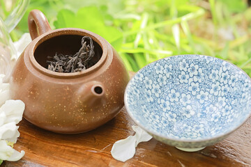 Wall Mural - large leaf Chinese tea in a teapot, infusion