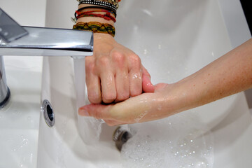  Wash hands by rubbing with soap for prevention of corona virus, hygiene to stop spreading coronavirus.