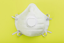 Protective Face Mask On A Yellow Background