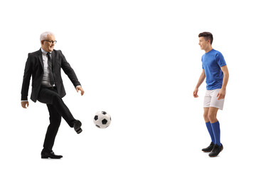 Sticker - Full length profile shot of a mature businessman and a young footballer playing soccer