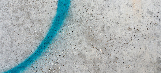 Grey old grunge concrete cement wall with painted drawing light blue graffiti line element. Urban street art rough banner background texture