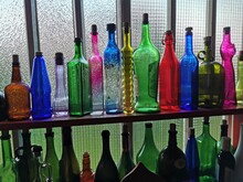 Colorful Bottles Of Vine On Window, Home Decoration 