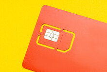 Sim Card For Mobile Phone Isolated On Yellow Background. 4G Sim Card For Smartphone Cut Out