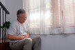 © CandyRetriever  - Asian senior man sitting alone on staircase at home with sickness. Stressed elderly male have stomachache and feel unwell need for medicine. Senior people health care and illness recovery concept