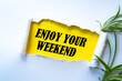 © Uuganbayar - Text sign showing enjoy your weekend