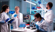 Leinwandbild Motiv Group of researcher in healthcare laboratory study virus to discover vaccineResearch chemists working in lab with high tech analyzing blood and genetic material samples discovery,