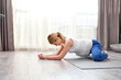 © alfa27 - young healthy pregnant woman doing exercises on floor, at home alone