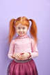 © alfa27 - Shy diligent redhead kid girl with two pony tails posing at camera, smiling