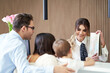 © Kalim - Picture of family checking in hotel