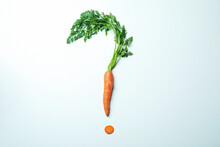 Question Mark Made Of Carrot On White Background