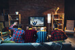 © master1305 - Group of friends watching TV, sport match together. Emotional fans cheering for favourite team, watching on exciting game. Concept of friendship, leisure activity, emotions