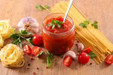 Tomato Sauce And Pasta On Wood Background