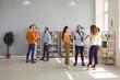 © Studio Romantic - Groups of diverse people standing and talking at company networking event. Men and women meeting in modern spacious office workspace, exchanging opinions and ideas and making useful business contacts