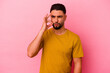 © Asier - Young mixed race man isolated on pink background