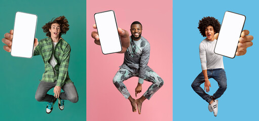 cool young guys with empty smartphones jumping up in air over colorful studio backgrounds, mobile ap